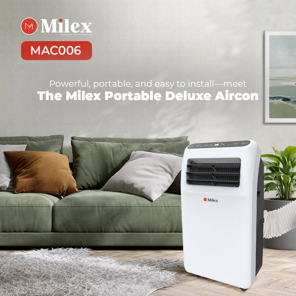 Milex portable deluxe aircon in a living room setting with a green sofa and plant.