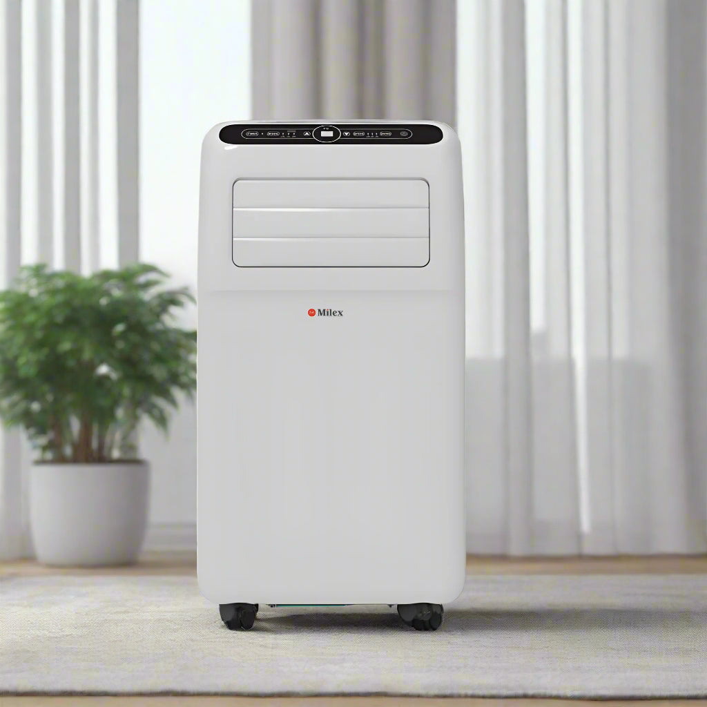 Milex Portable air conditioner in a room with curtains and a plant